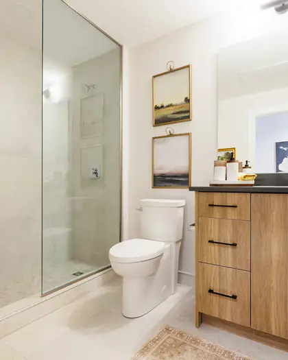 Bathroom with a wooden vanity and glass shower