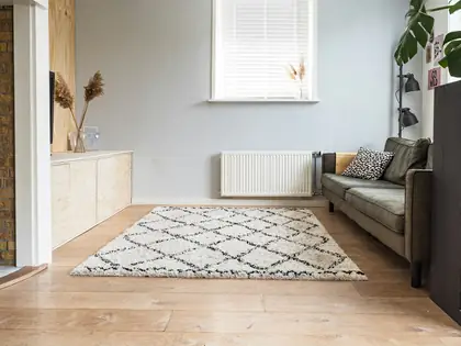 Empty bright room with wood floors and a large window